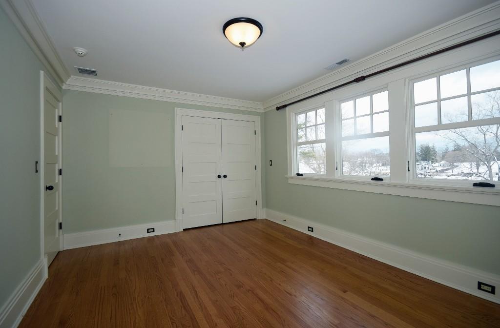 27 Harbor Road Darien, CT 06820 - Photo 16 of 22 an empty room with wooden floor and windows