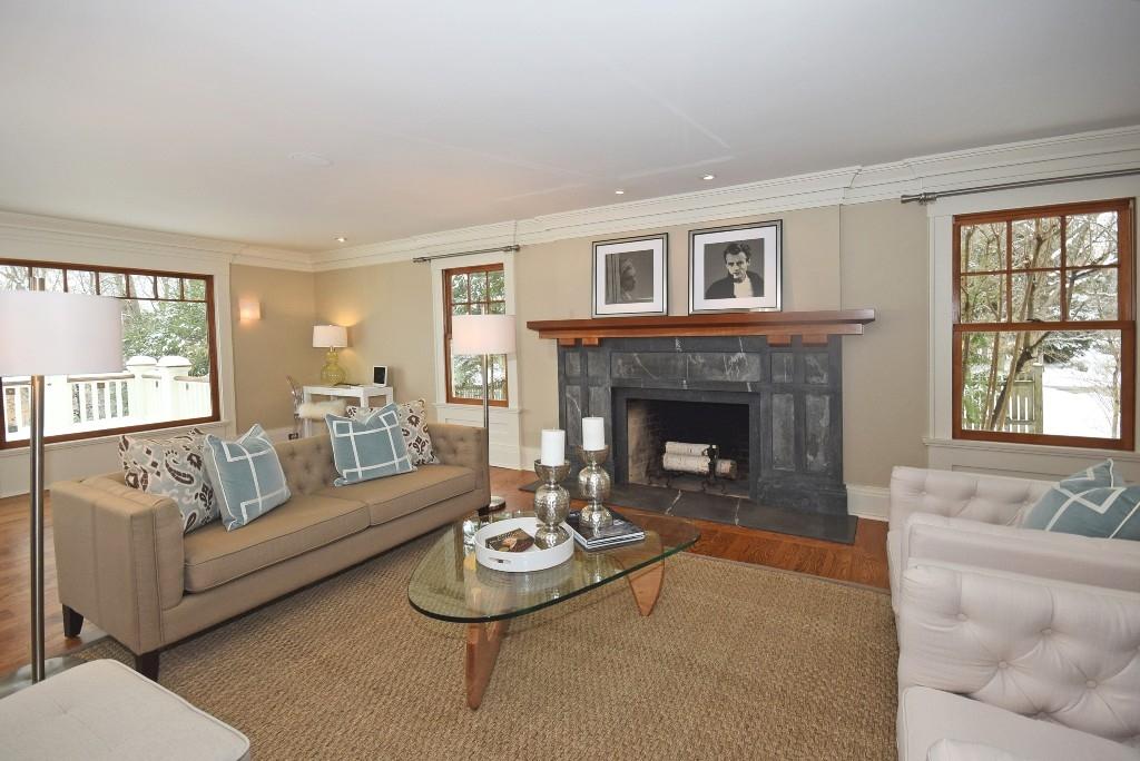 27 Harbor Road Darien, CT 06820 - Photo 7 of 22 a living room with furniture and a fireplace