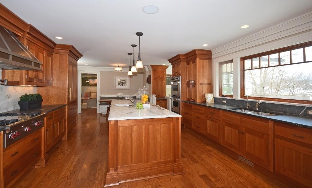 27 Harbor Road Darien, CT 06820 - Photo 10 of 22 a view of a kitchen with kitchen island granite countertop wooden floors and a sink