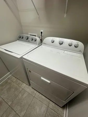 a utility room with dryer and washer