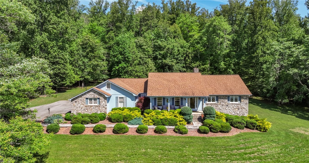 1335 Shingle Gap Road Purlear, NC 28665 - Photo 1 of 49 a aerial view of a house with yard and green space
