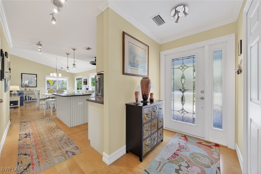 1043 Sand Castle Road Sanibel, FL 33957 - Photo 4 of 32 a living room with furniture and a rug