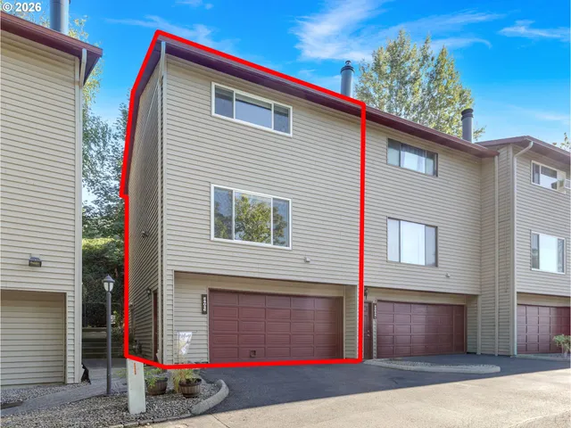 a view of a house with a garage
