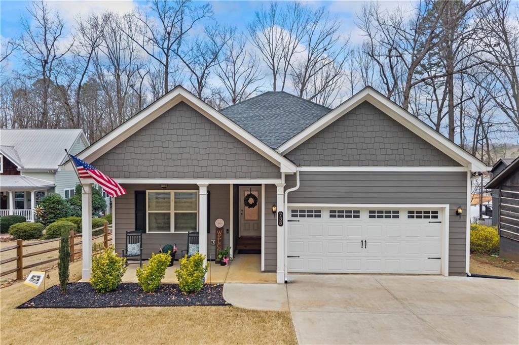 738 Normandy Trail Lavonia, GA 30553 - Photo 1 of 1 a view of a house with a yard and potted plants