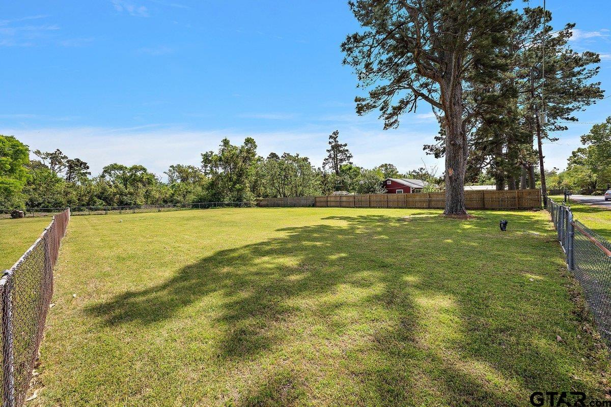 303 Fairview Street Rusk, TX 75785 - Photo 2 of 3 a view of yard with swimming pool and trees