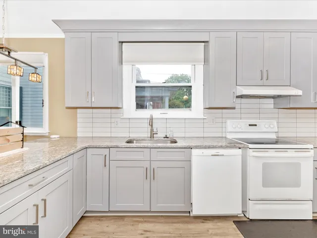 a bed room with a bed and a window