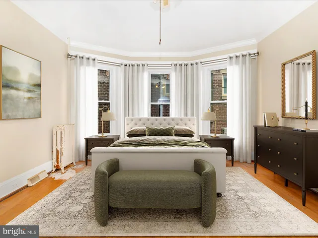 an empty room with wooden floor and chandelier fan