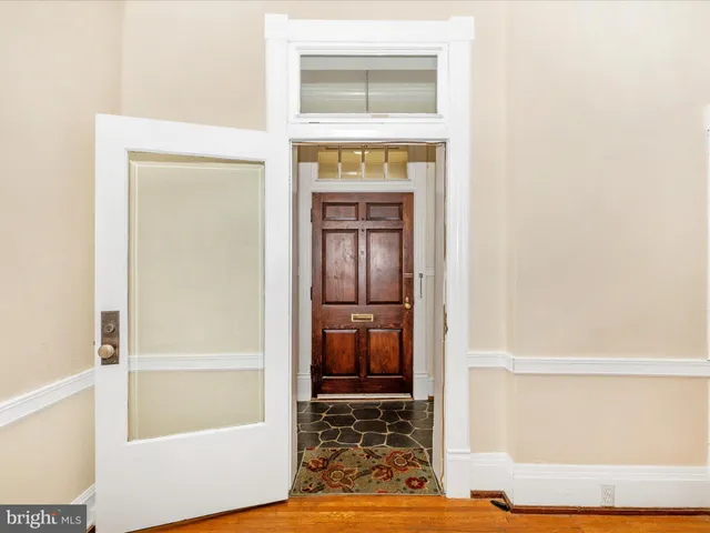a living room with fireplace furniture and a flat screen tv