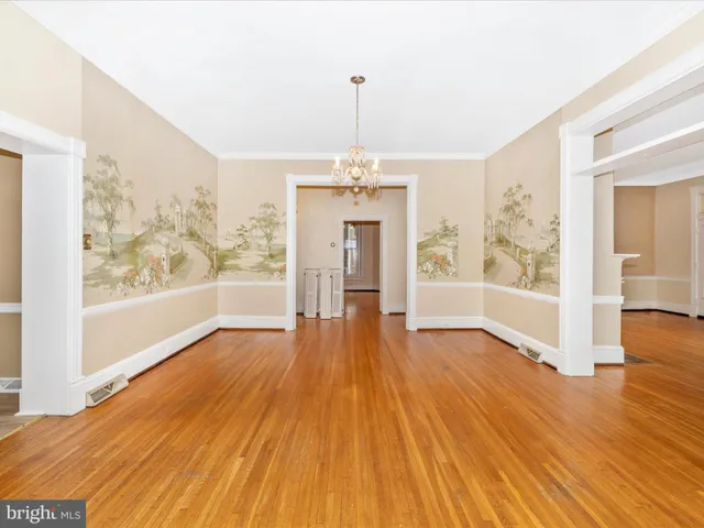 a kitchen with stainless steel appliances granite countertop a sink cabinets and wooden floor