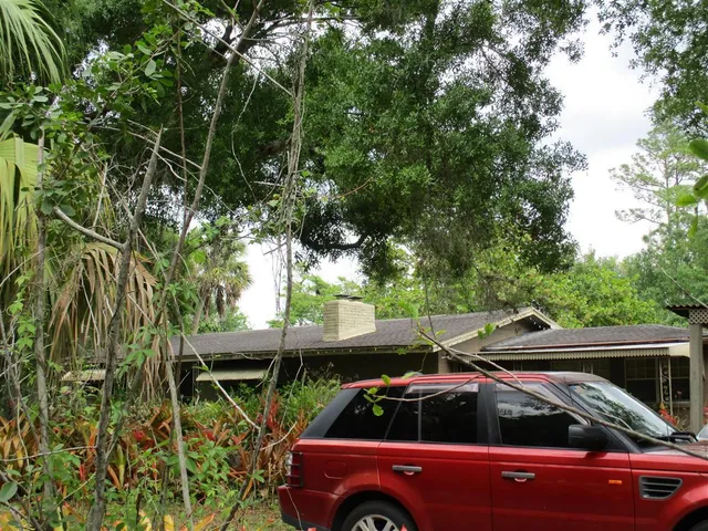 a view of a car parked in front of a house