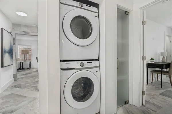 a view of a hallway with washer and dryer