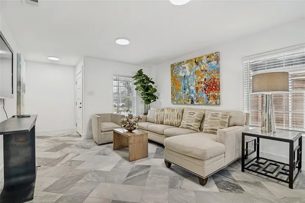 a living room with furniture and a window