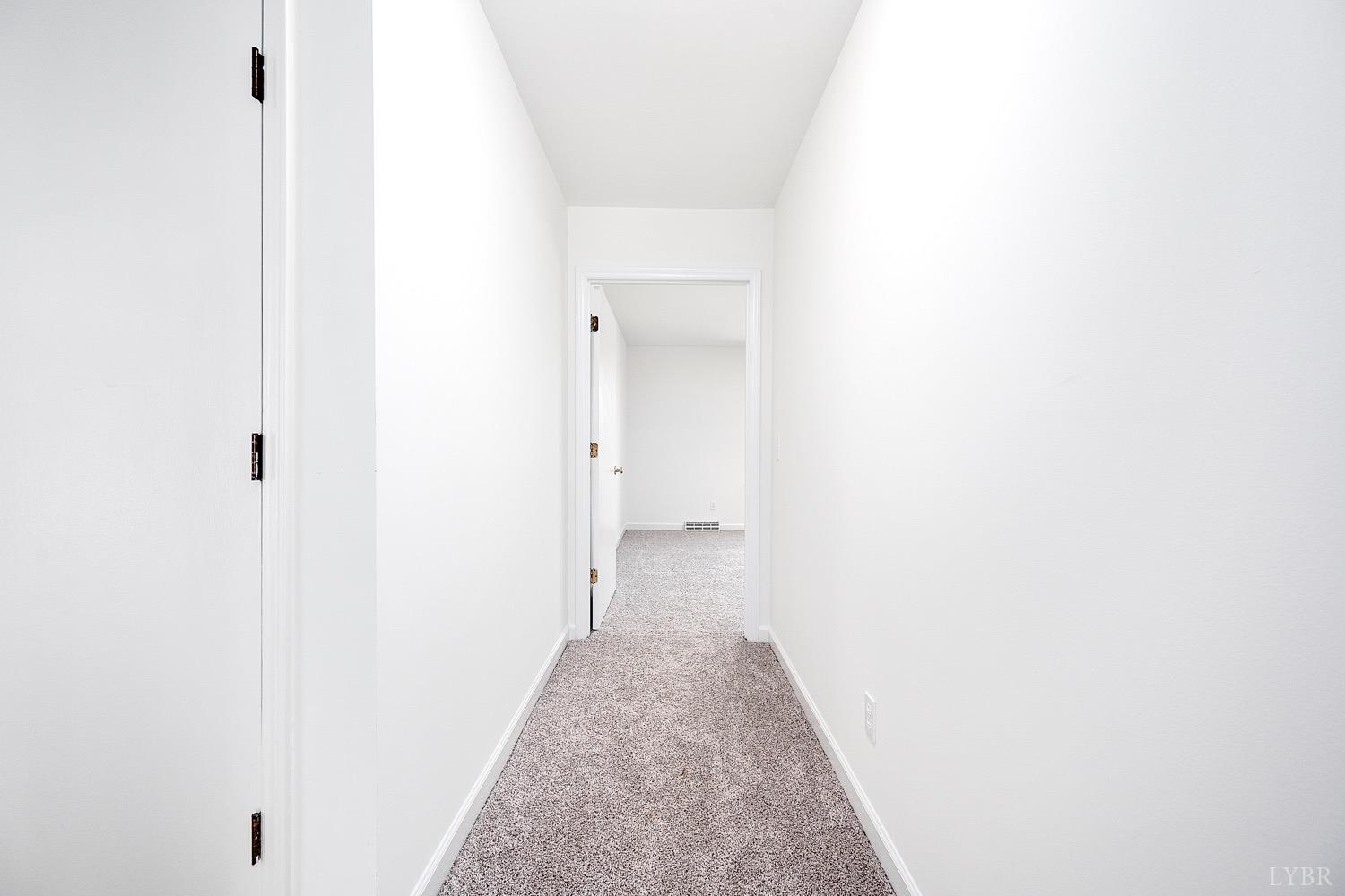 1309 White Fall Road Gretna, VA 24557 - Photo 27 of 64 a view of a hallway with wooden floor