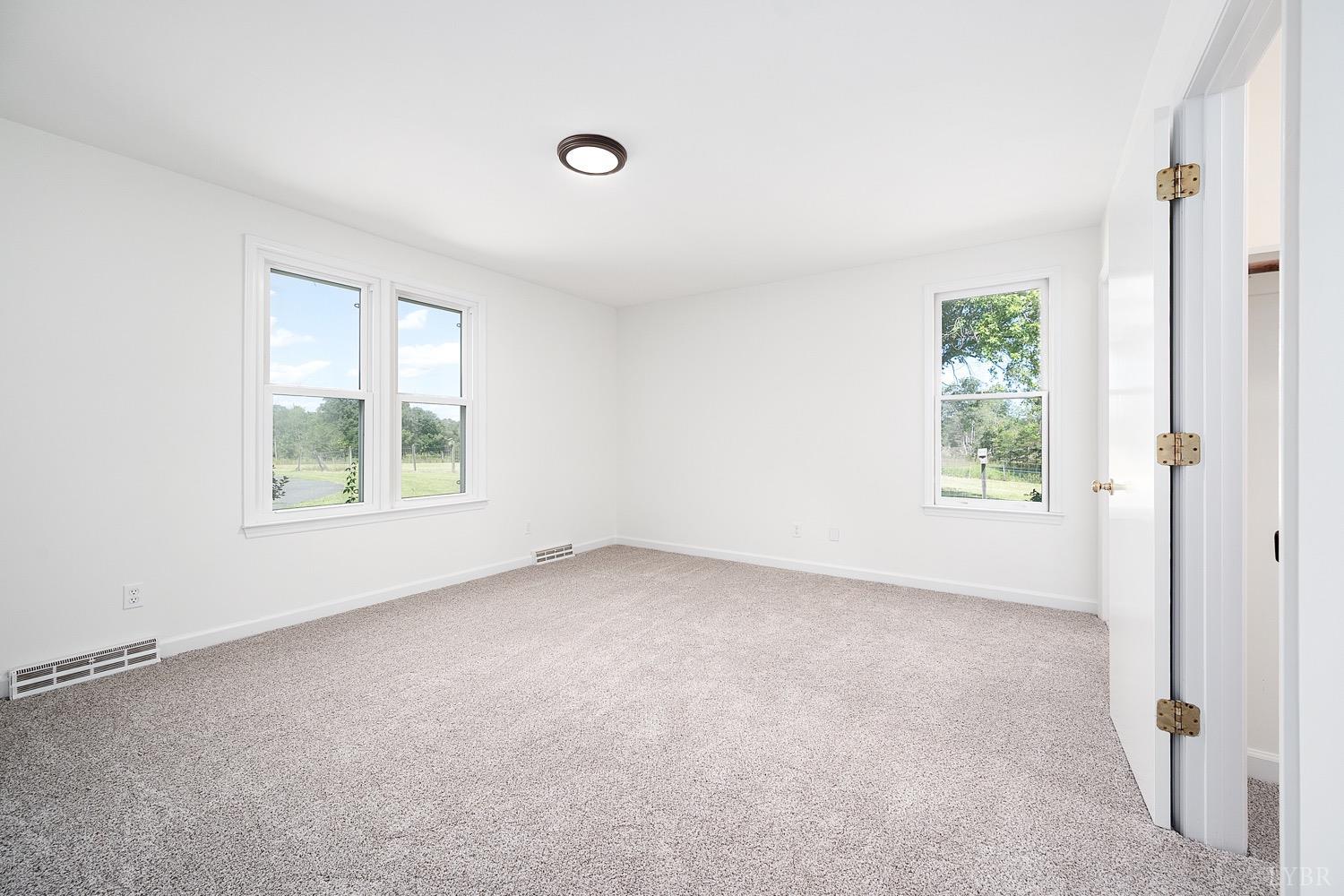 1309 White Fall Road Gretna, VA 24557 - Photo 28 of 64 an empty room with windows