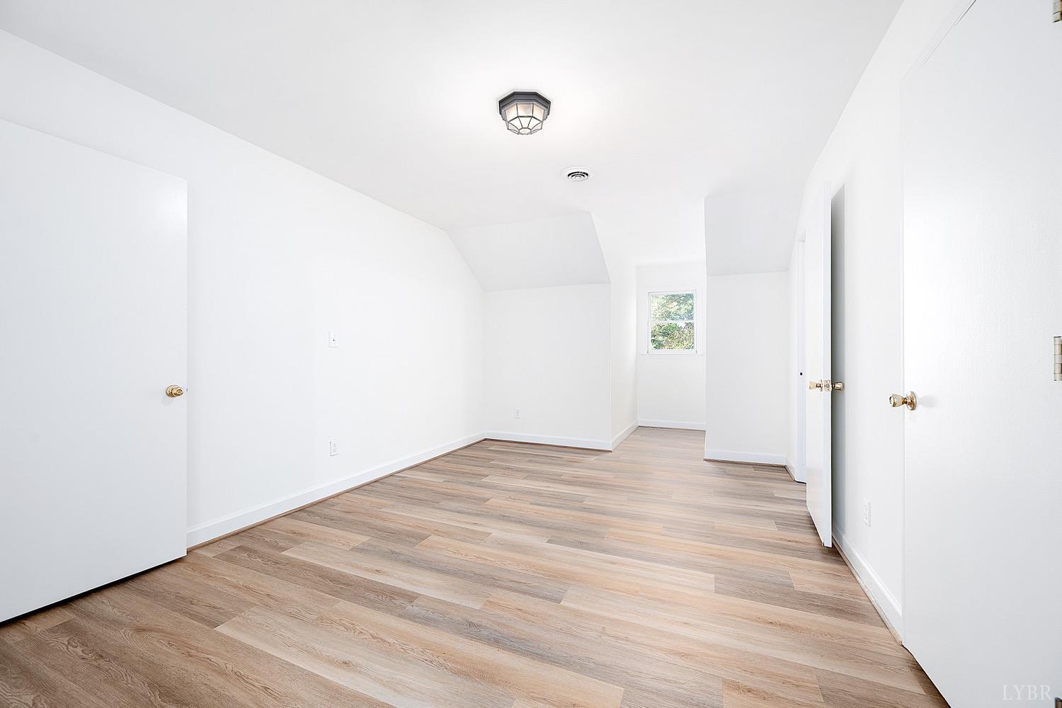 1309 White Fall Road Gretna, VA 24557 - Photo 34 of 64 a view of an empty room with wooden floor