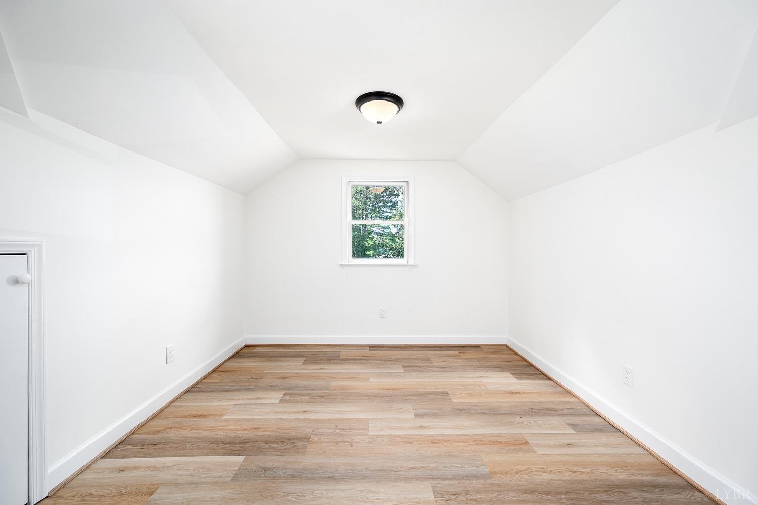 1309 White Fall Road Gretna, VA 24557 - Photo 39 of 64 a view of a room with wooden floor and window