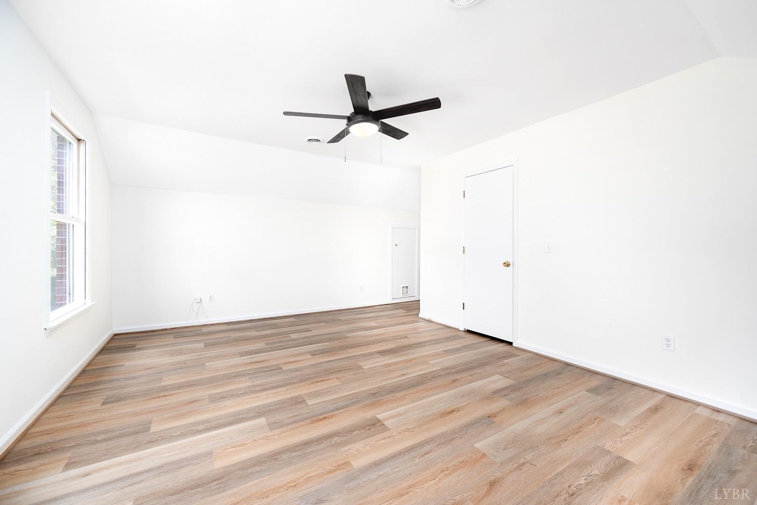 1309 White Fall Road Gretna, VA 24557 - Photo 45 of 64 a view of an empty room with wooden floor and a window