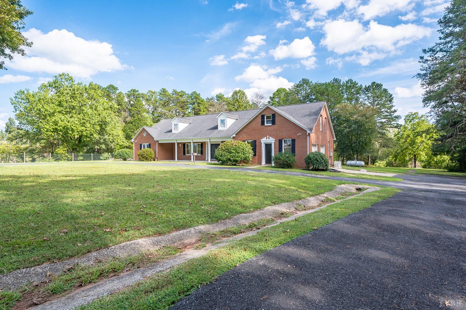 1309 White Fall Road Gretna, VA 24557 - Photo 59 of 64 a front view of a house with a yard