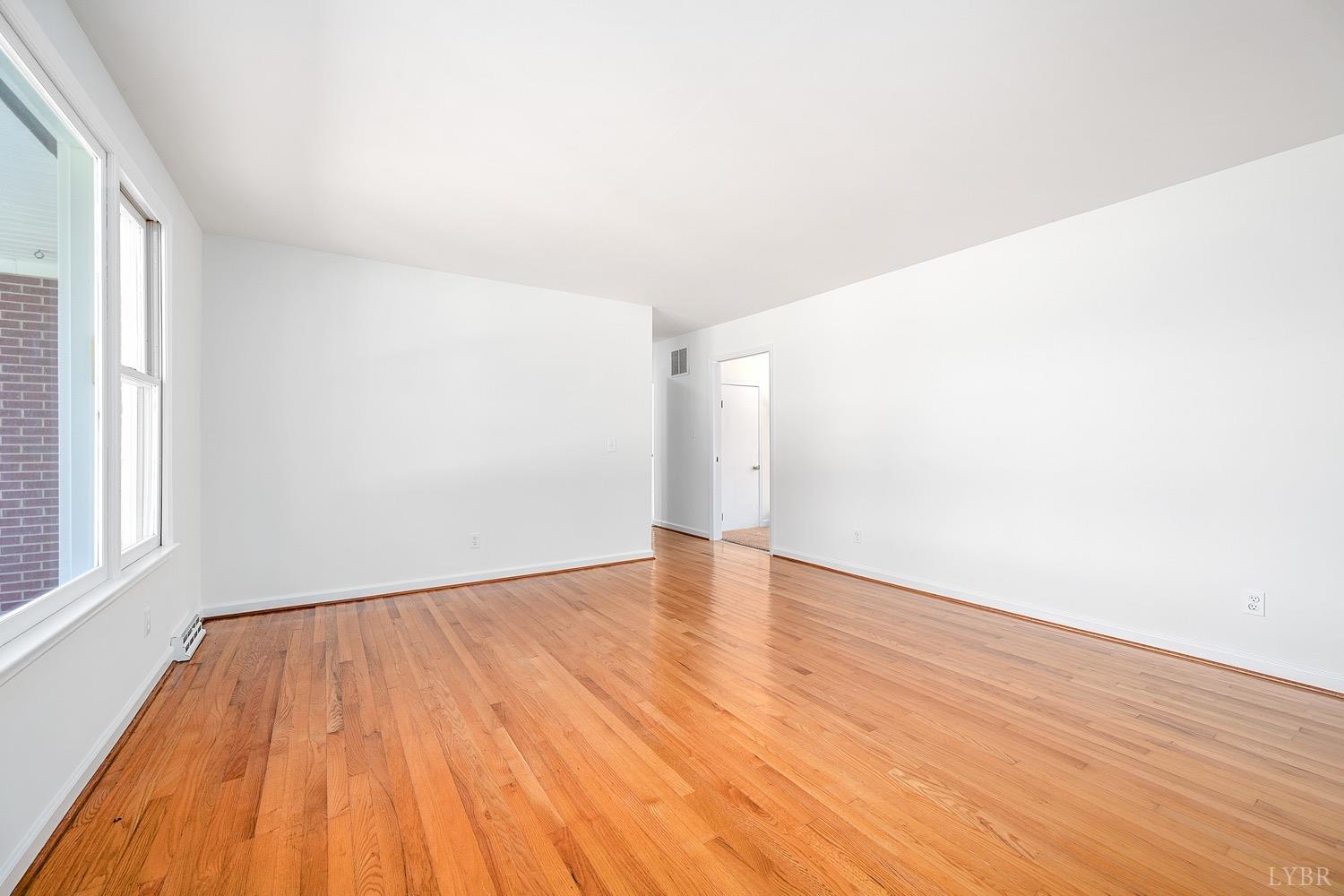 1309 White Fall Road Gretna, VA 24557 - Photo 8 of 64 a view of empty room with wooden floor and fan