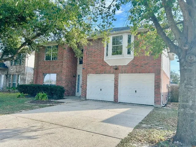 a view of a house with a tree