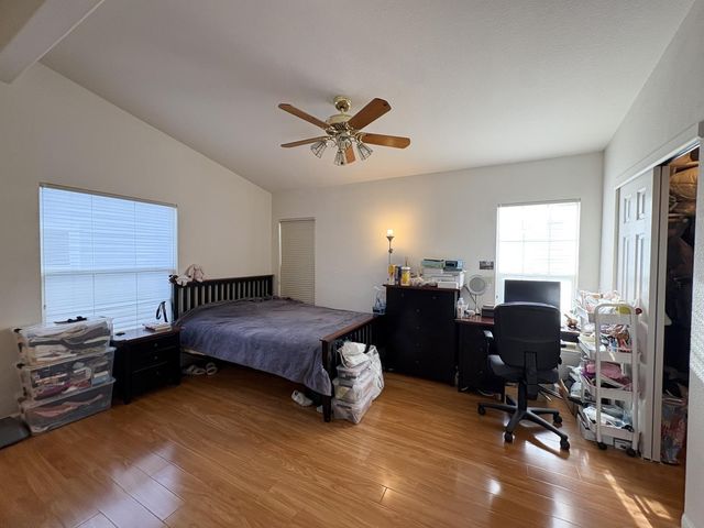 a bedroom with a workspace