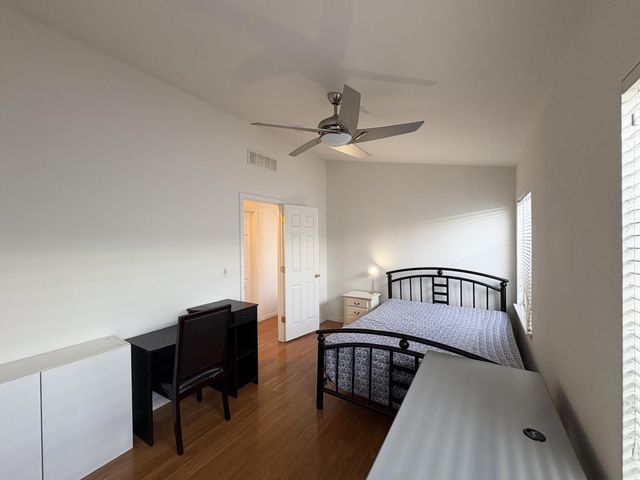 a bedroom with furniture and a window