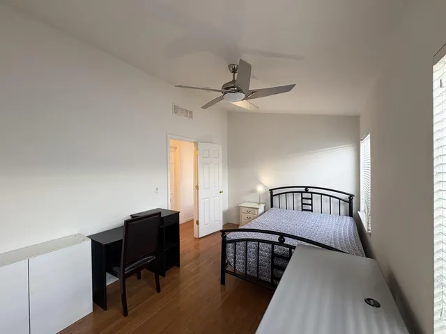 a bedroom with furniture and a window