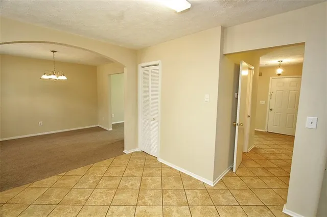 a view of a room with windows and chandelier