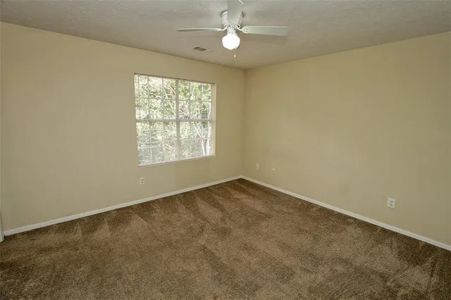 an empty room with a glass door