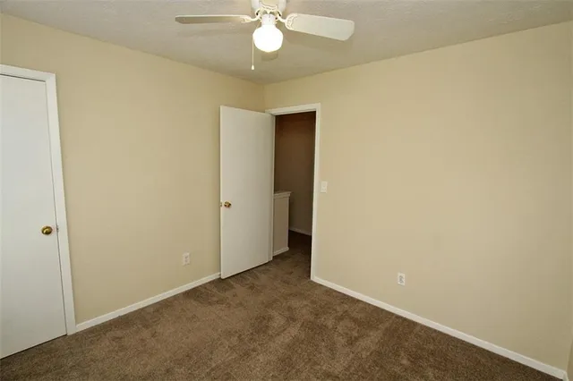 a bathroom with a sink mirror and a shower