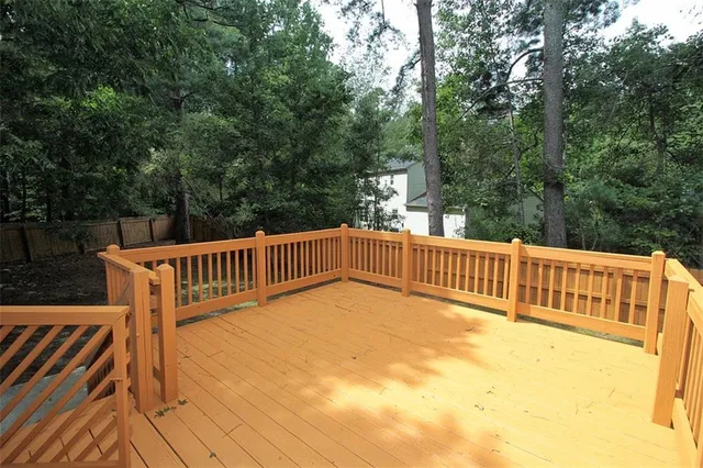 a view of a backyard with large trees