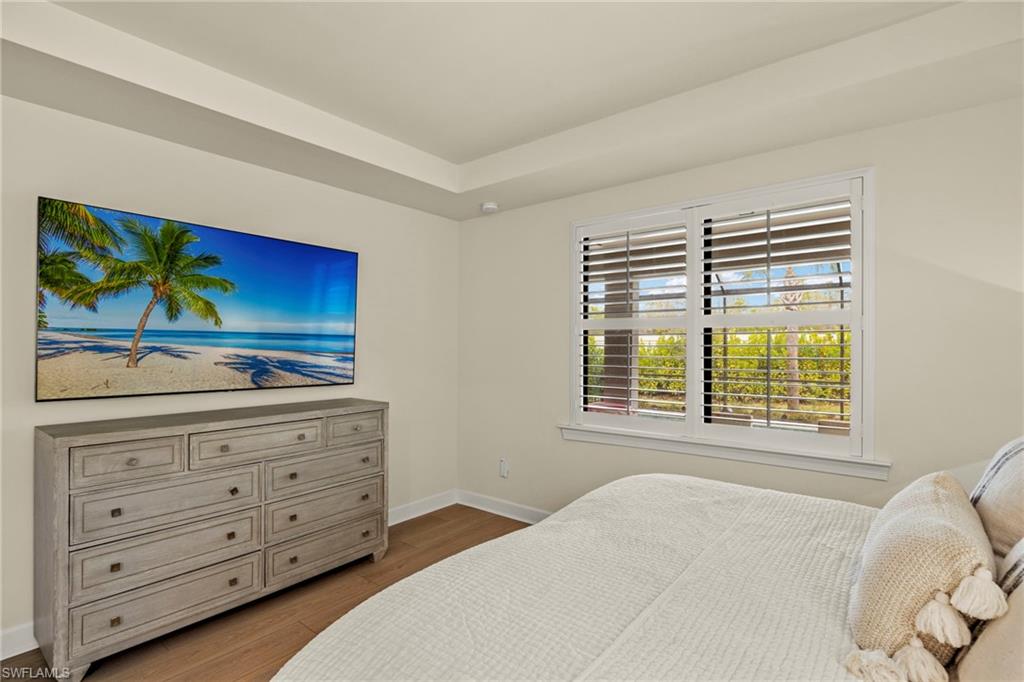 2170 Yellowfin Circle Naples, FL 34114 - Photo 12 of 26 a bedroom with a bed and a dresser