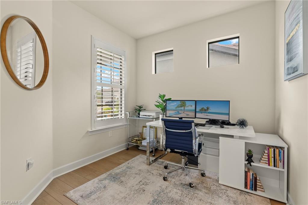 2170 Yellowfin Circle Naples, FL 34114 - Photo 18 of 26 a view of a workspace with furniture and a window