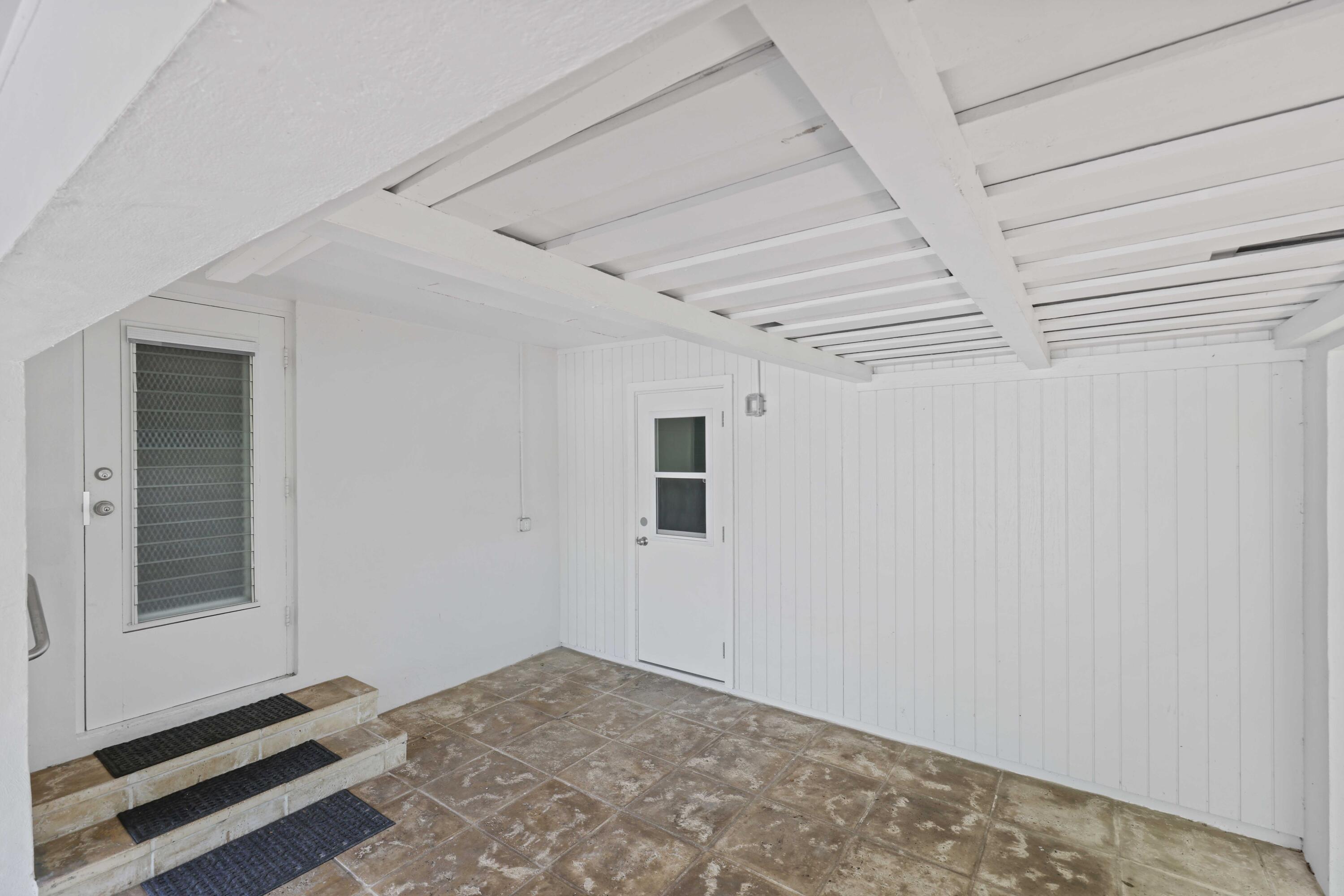 246 Merrain Road Palm Beach, FL 33480 - Photo 19 of 31 a view of a room with rack on the wall