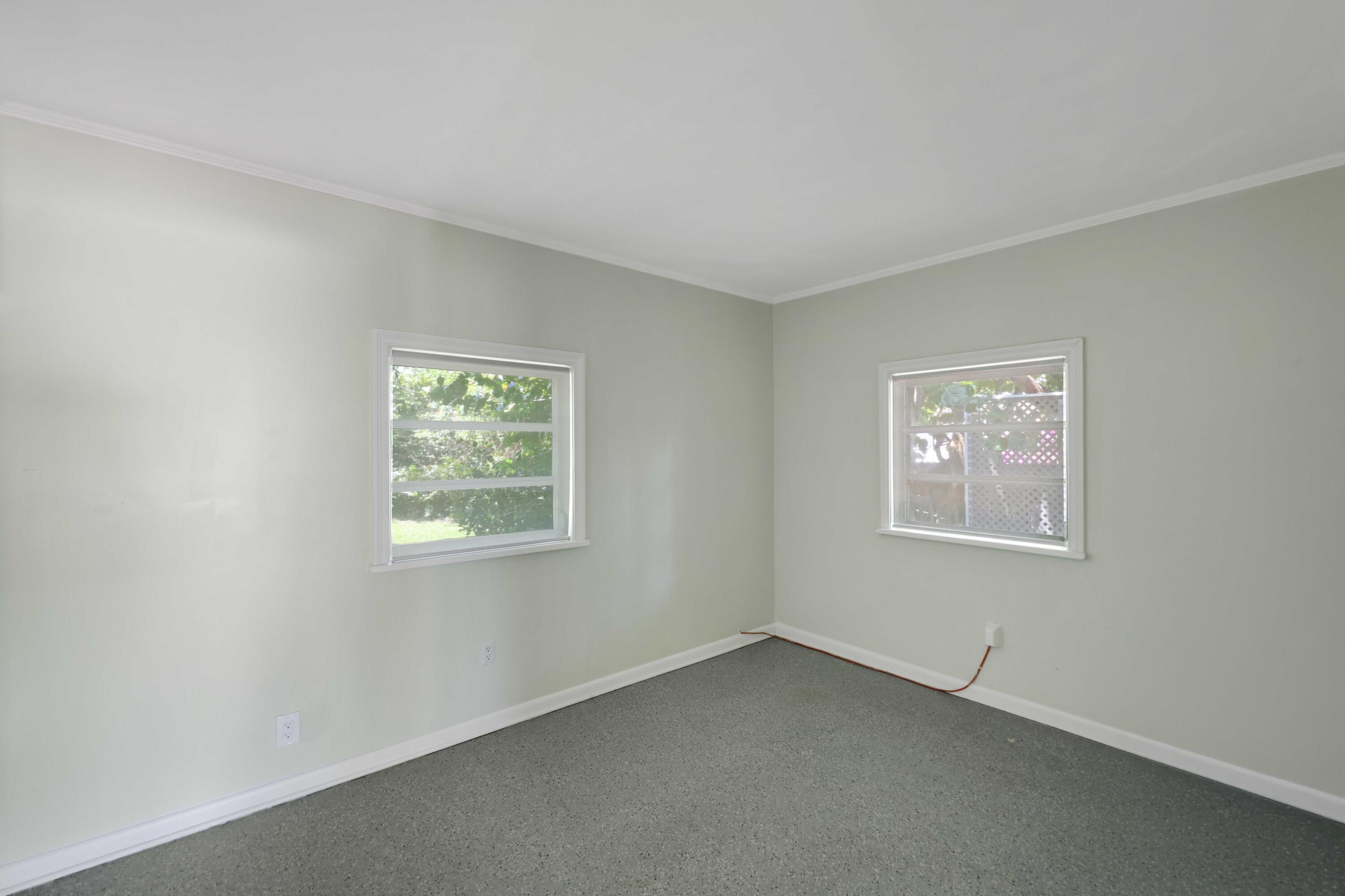 246 Merrain Road Palm Beach, FL 33480 - Photo 20 of 31 a view of an empty room with a window