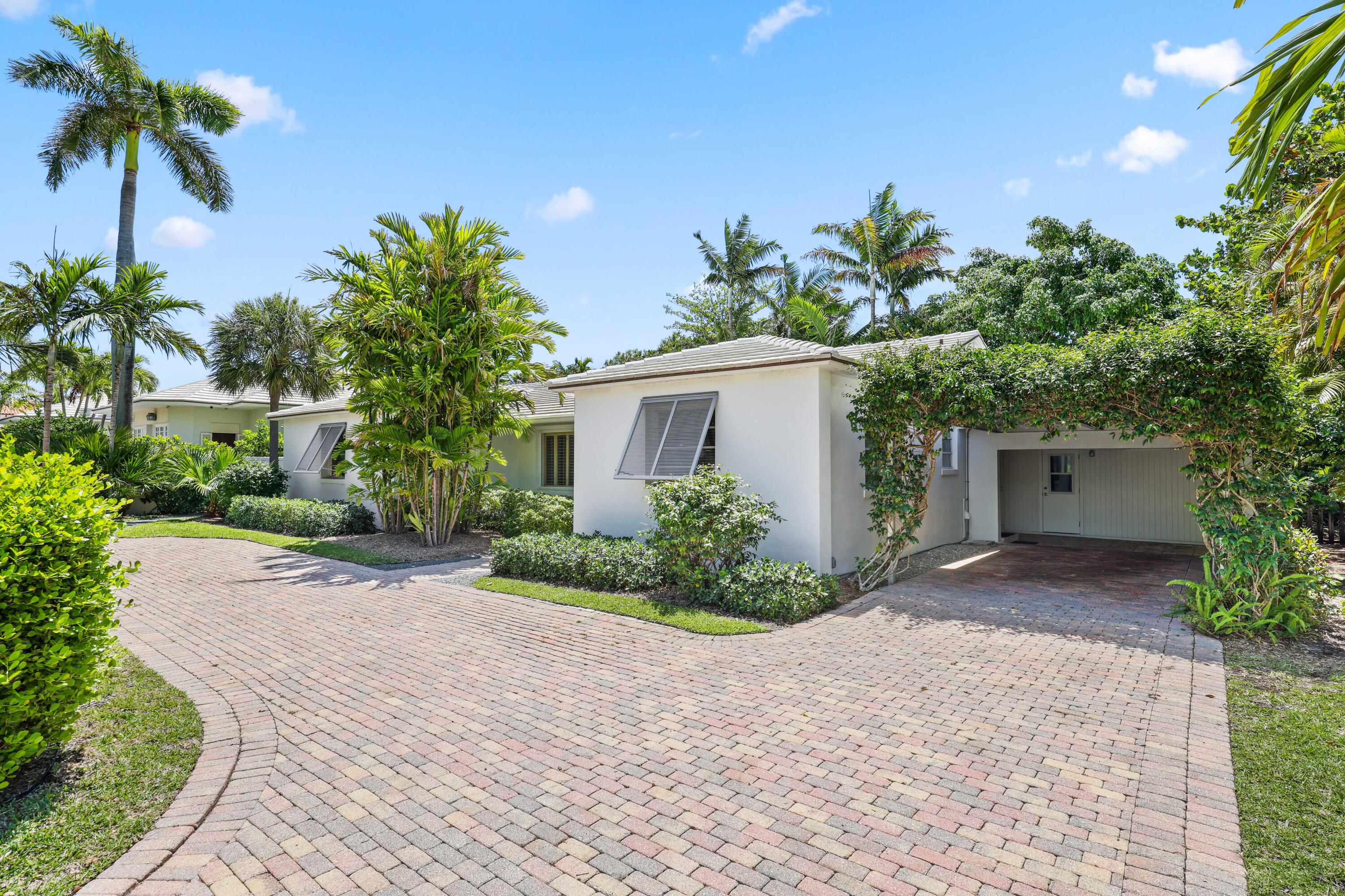 246 Merrain Road Palm Beach, FL 33480 - Photo 2 of 31 a view of a house with a yard and plant