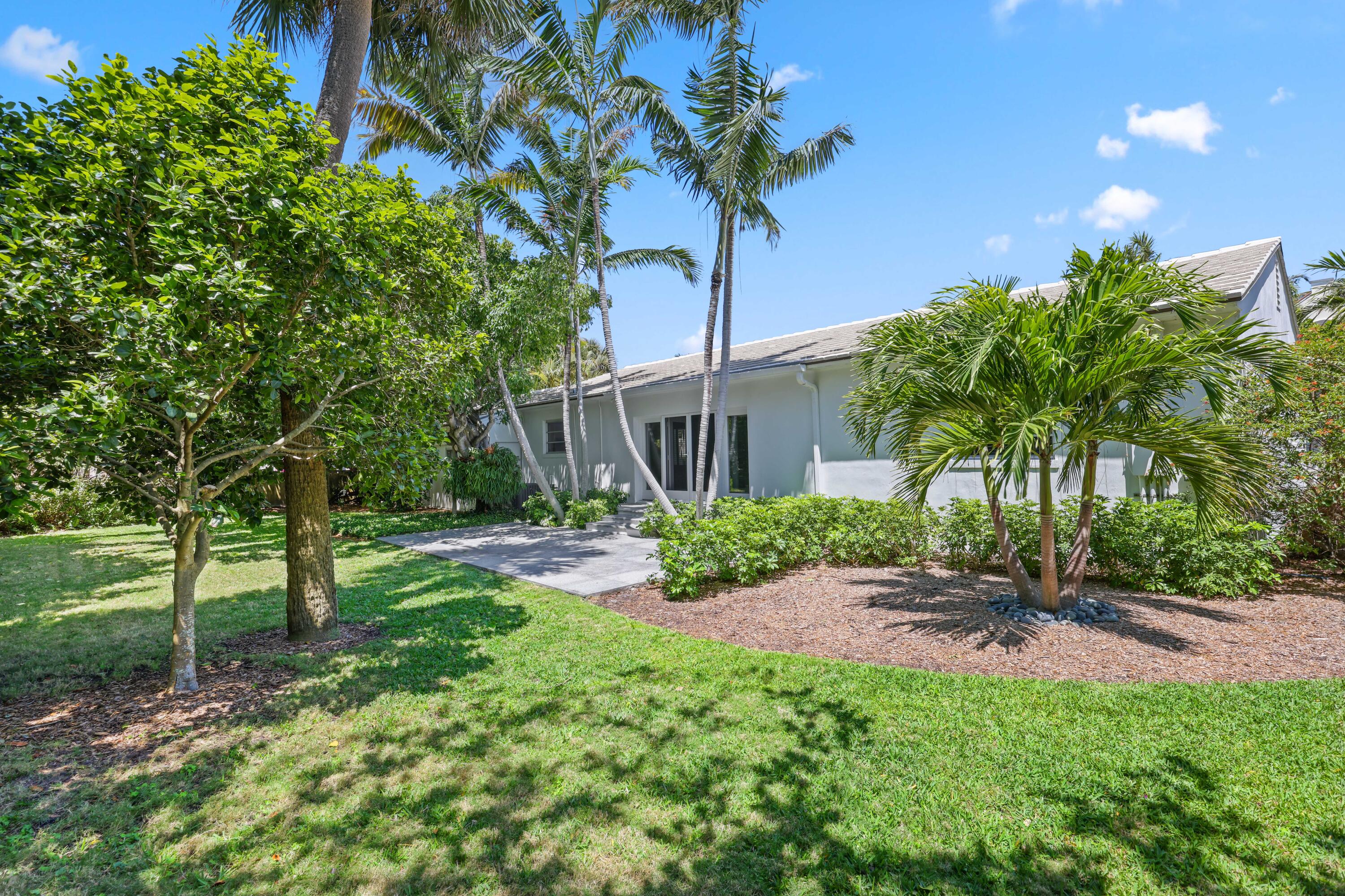 246 Merrain Road Palm Beach, FL 33480 - Photo 23 of 31 a house view with a garden space