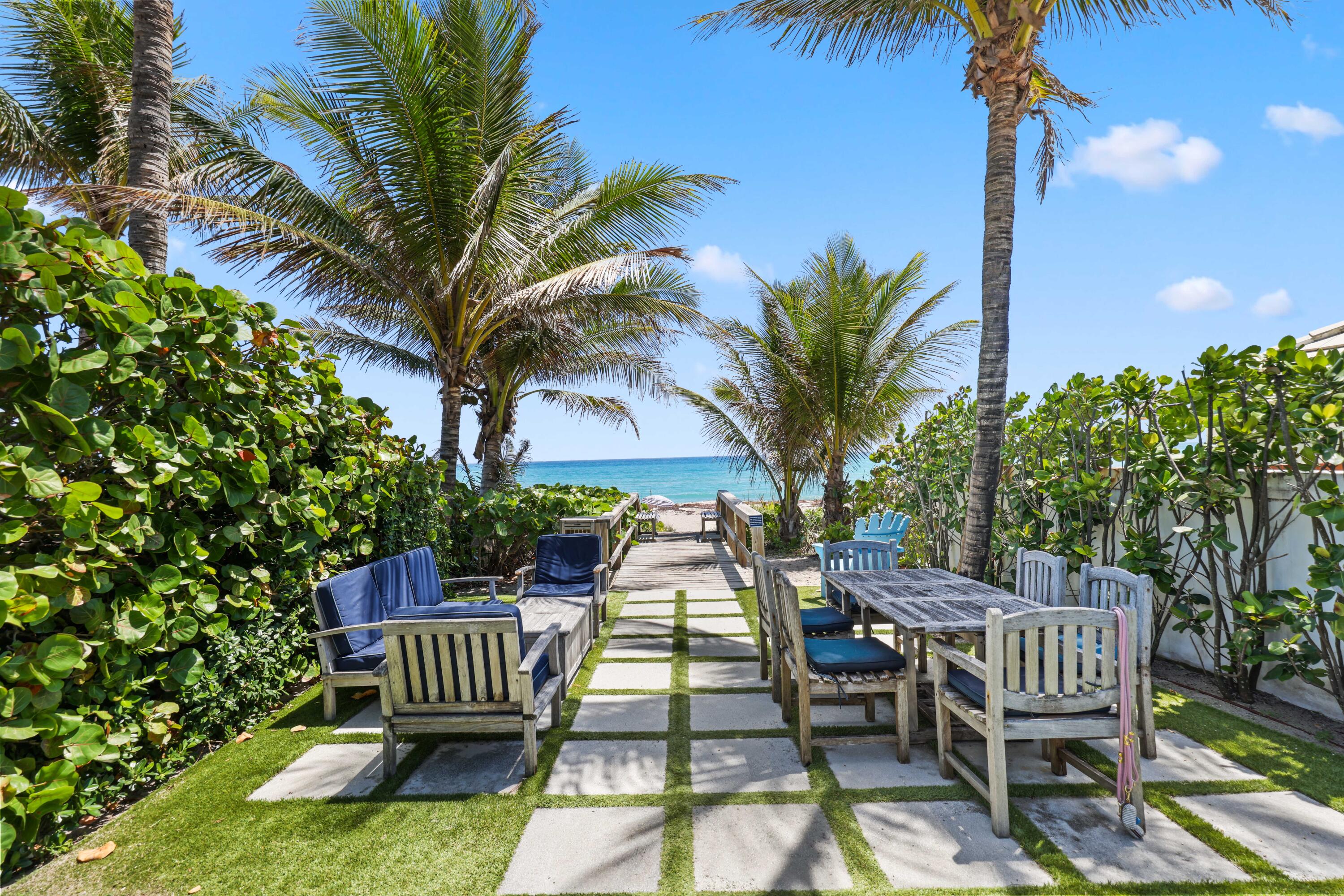 246 Merrain Road Palm Beach, FL 33480 - Photo 26 of 31 a view of a chairs and table in backyard