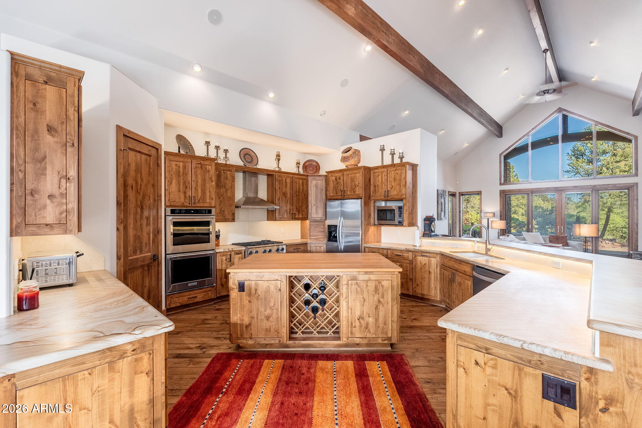 3000 East Thunder Point Payson, AZ 85541 - Photo 12 of 105 a living room with stainless steel appliances furniture a rug and a kitchen view