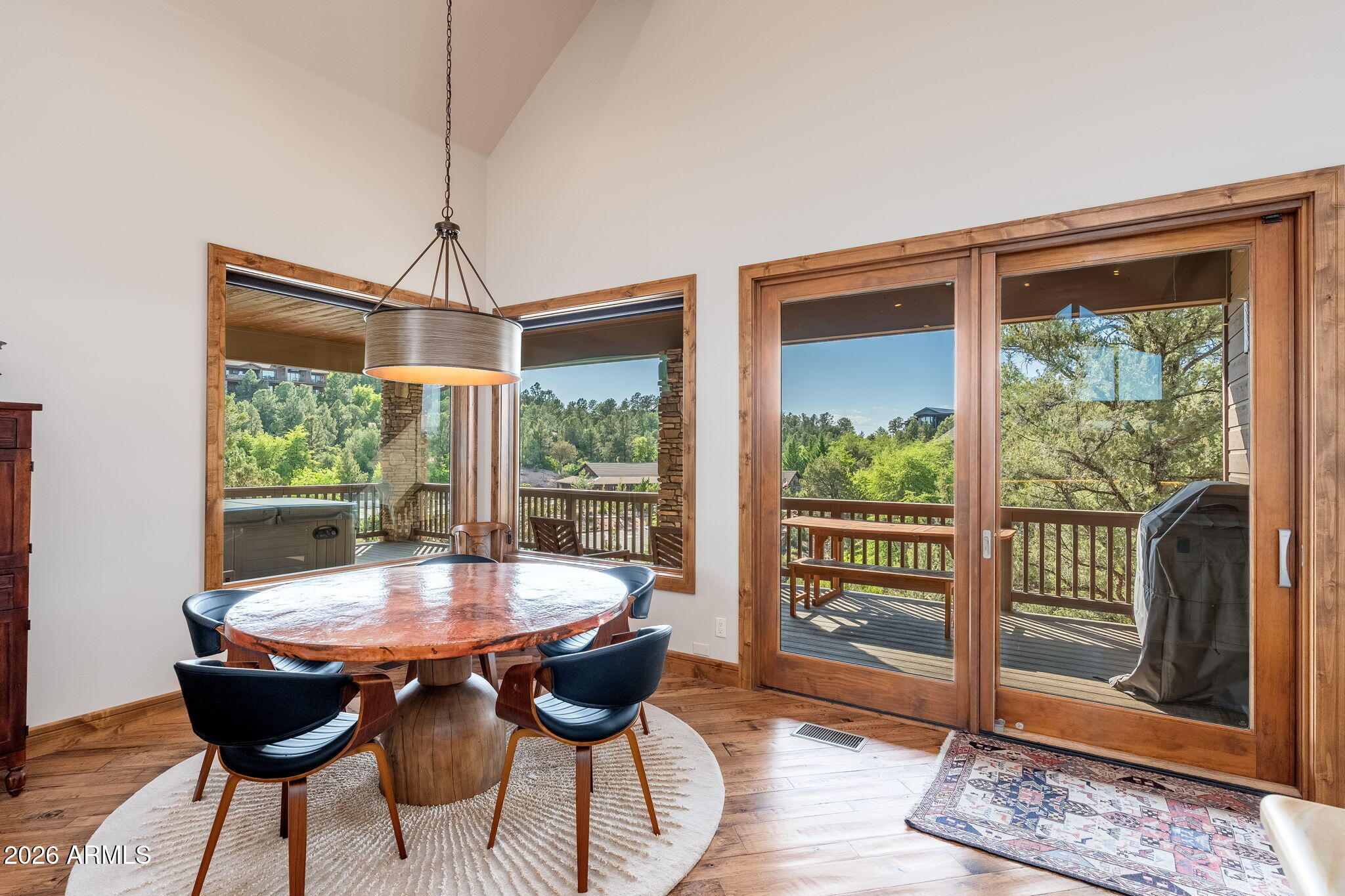 3000 East Thunder Point Payson, AZ 85541 - Photo 16 of 105 a view of a dining room with furniture wooden floor and a chandelier