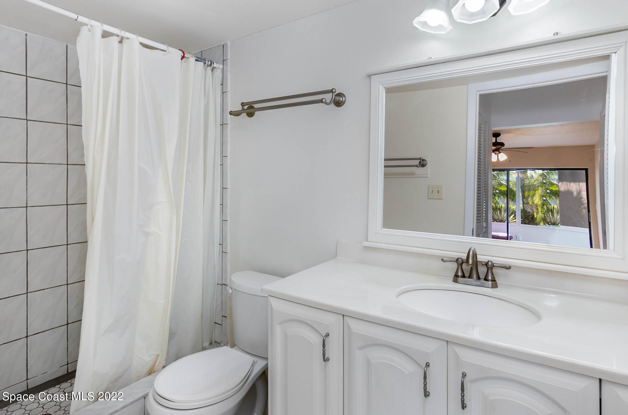 2 Country Club Road, Unit 20 Cocoa Beach, FL 32931 - Photo 15 of 23 a bathroom with a sink toilet and shower