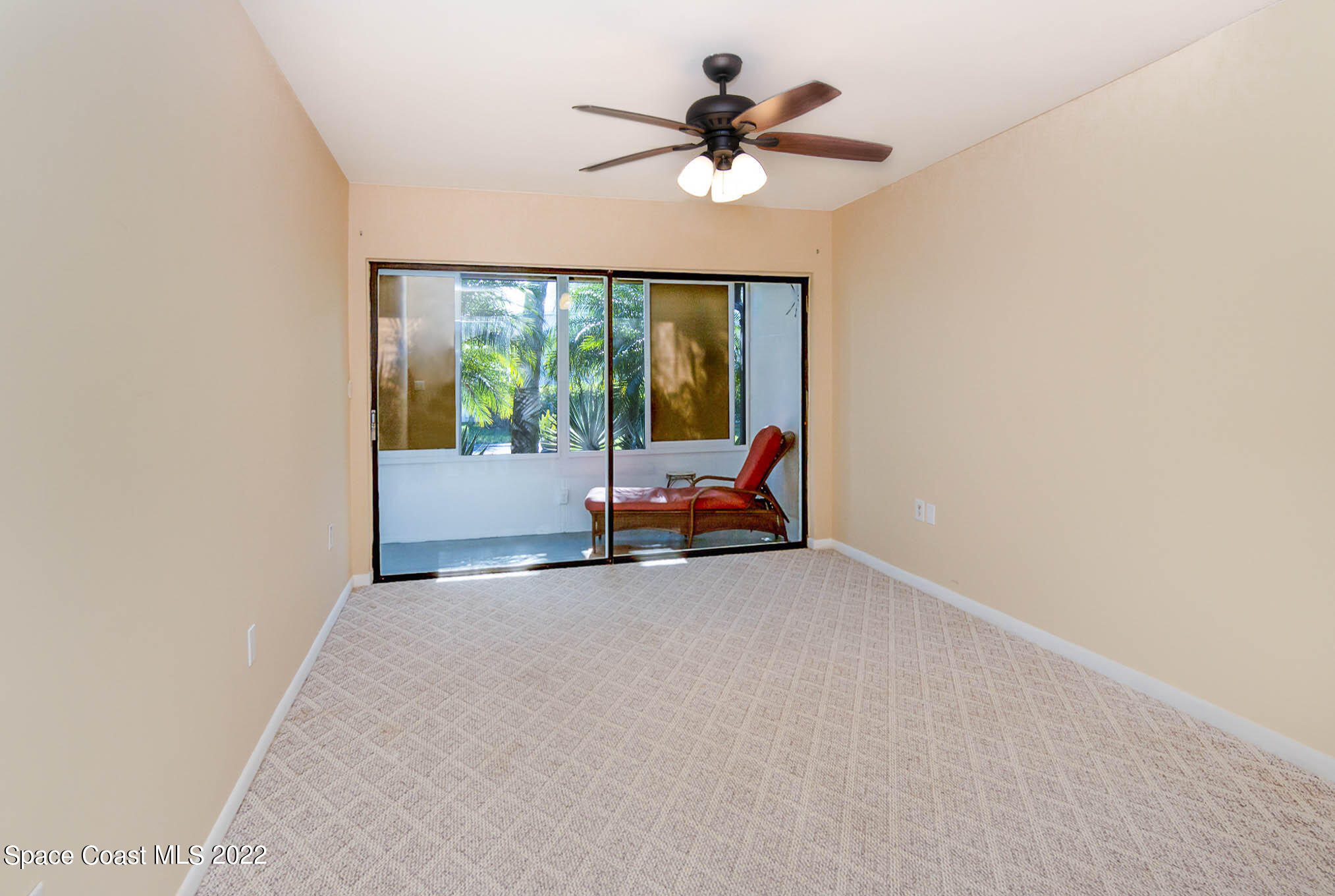 2 Country Club Road, Unit 20 Cocoa Beach, FL 32931 - Photo 16 of 23 a view of car with garage