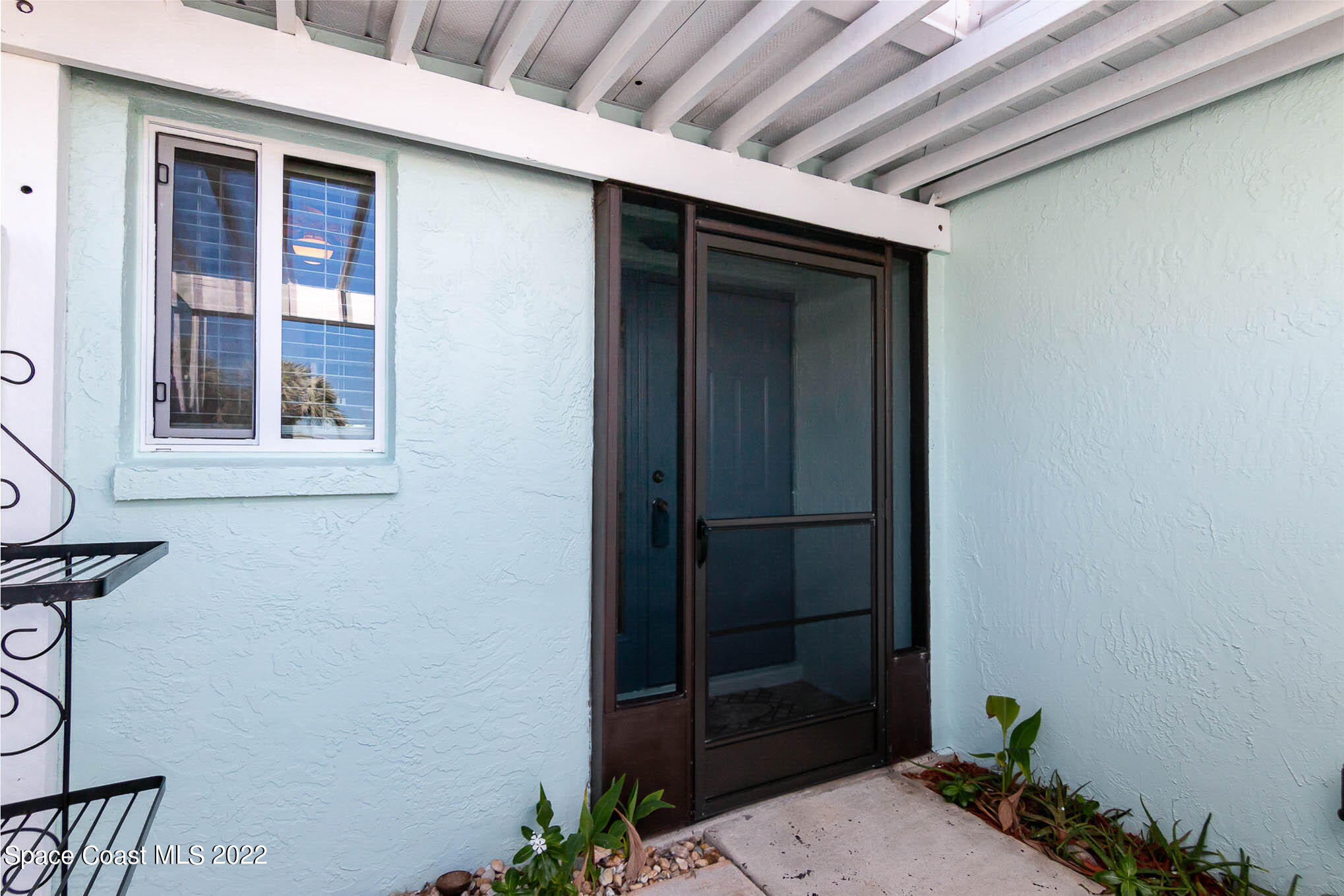 2 Country Club Road, Unit 20 Cocoa Beach, FL 32931 - Photo 2 of 23 a front view of a house