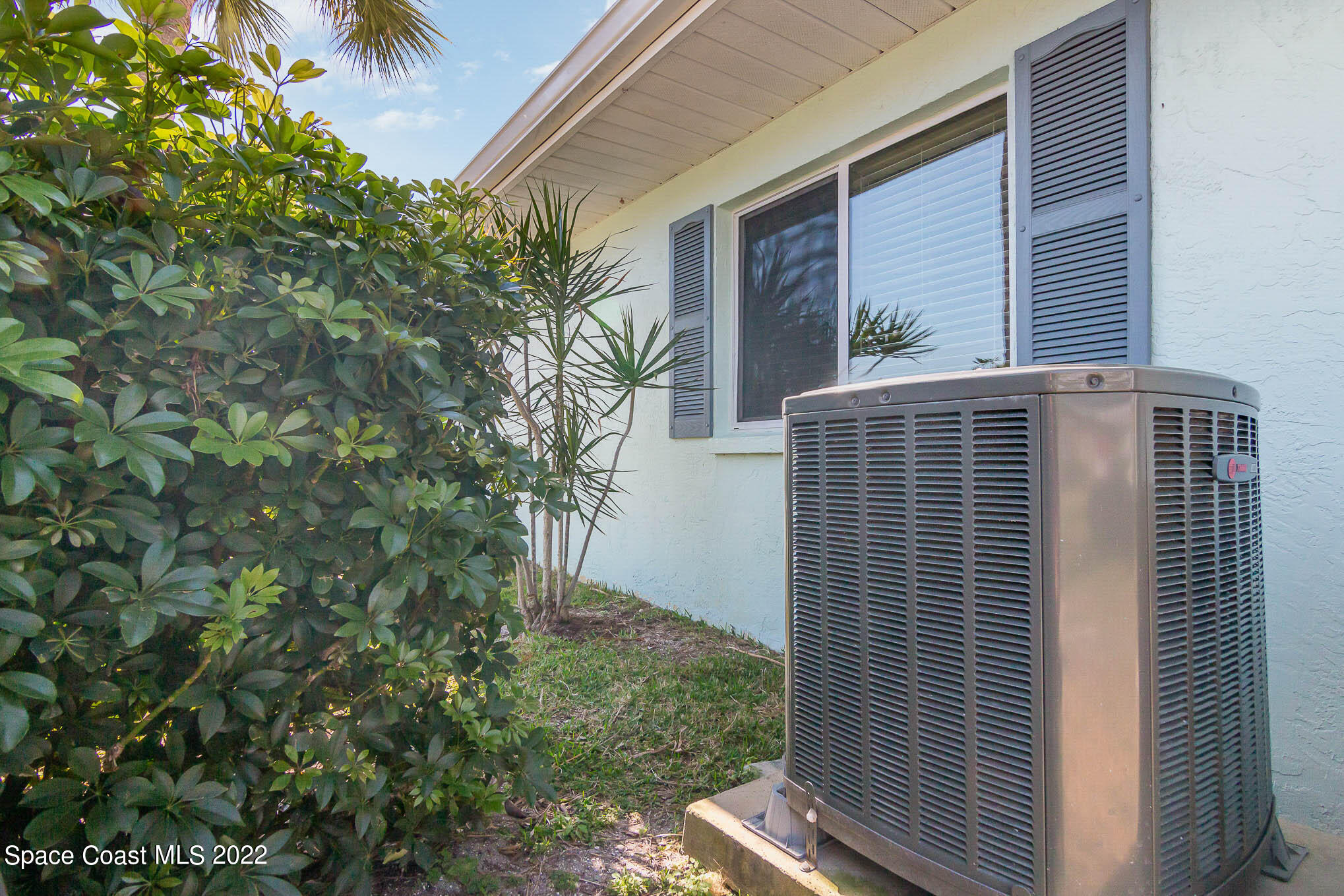 2 Country Club Road, Unit 20 Cocoa Beach, FL 32931 - Photo 23 of 23 a front view of a house with a tree