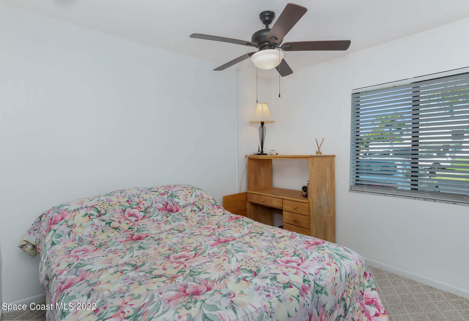 2 Country Club Road, Unit 20 Cocoa Beach, FL 32931 - Photo 4 of 23 a bedroom with a bed and a dresser