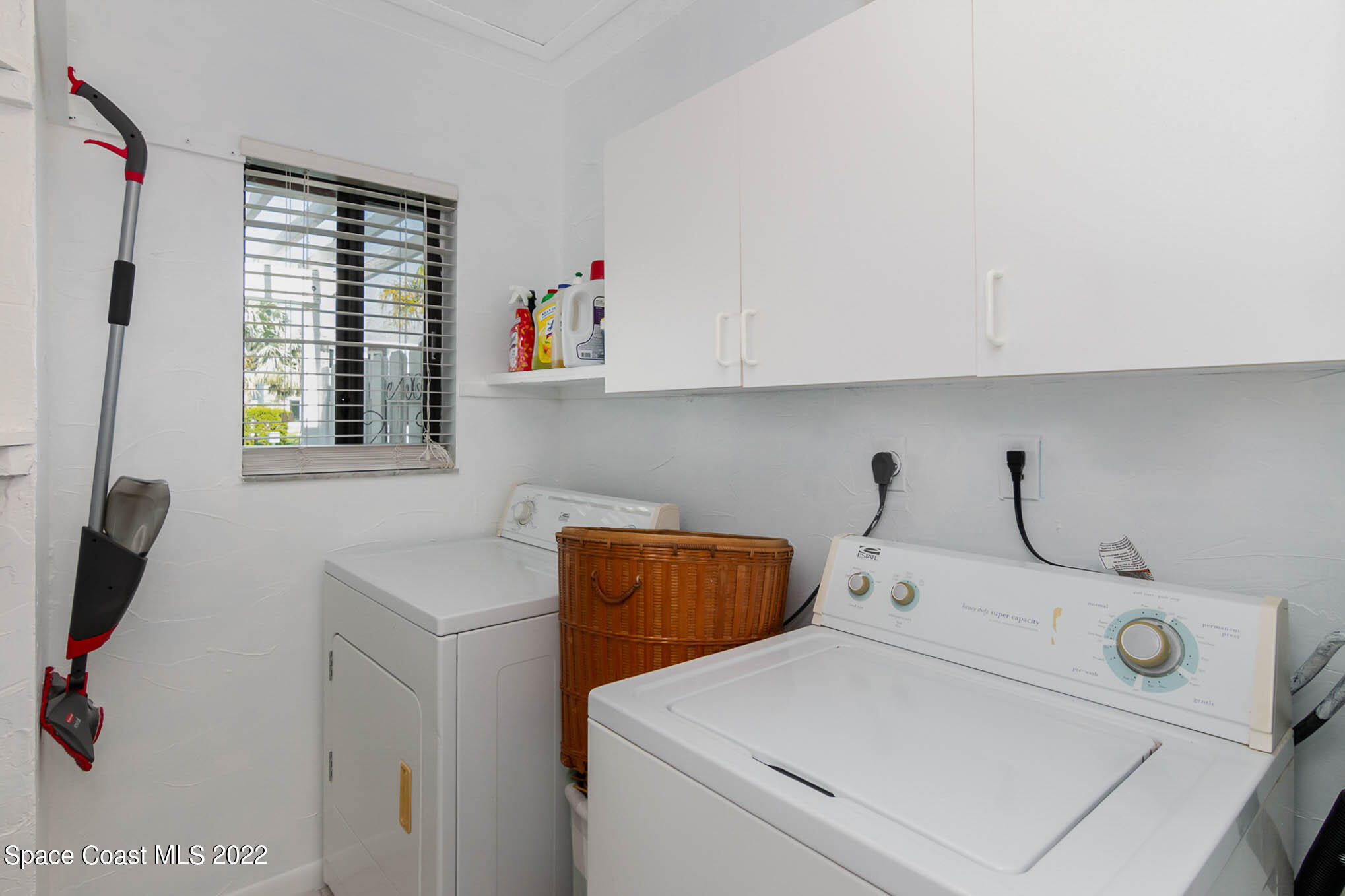 2 Country Club Road, Unit 20 Cocoa Beach, FL 32931 - Photo 9 of 23 a utility room with dryer and washer