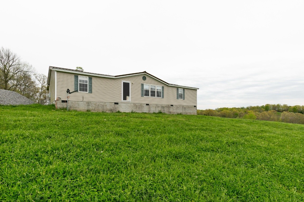 399 Calvert Ridge Road Westmoreland, TN 37186 - Photo 1 of 31 a house view with a garden space