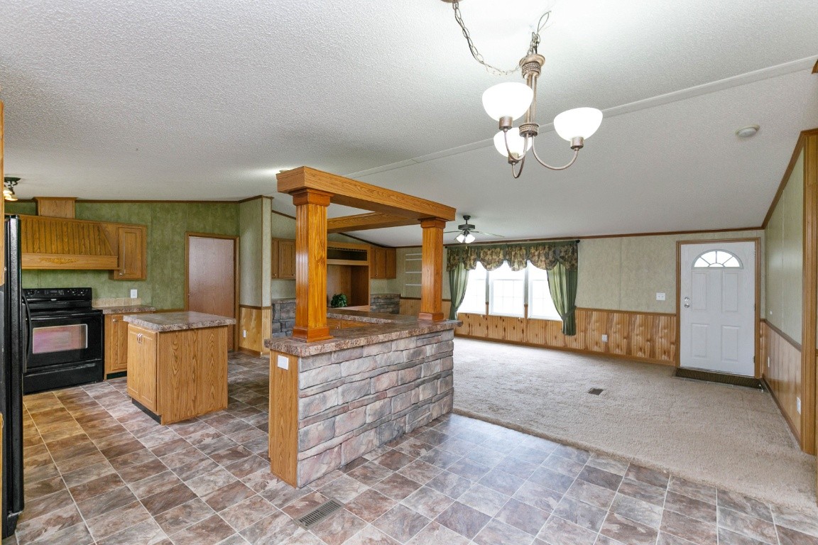 399 Calvert Ridge Road Westmoreland, TN 37186 - Photo 12 of 31 a view of a big room with chandelier fan and windows