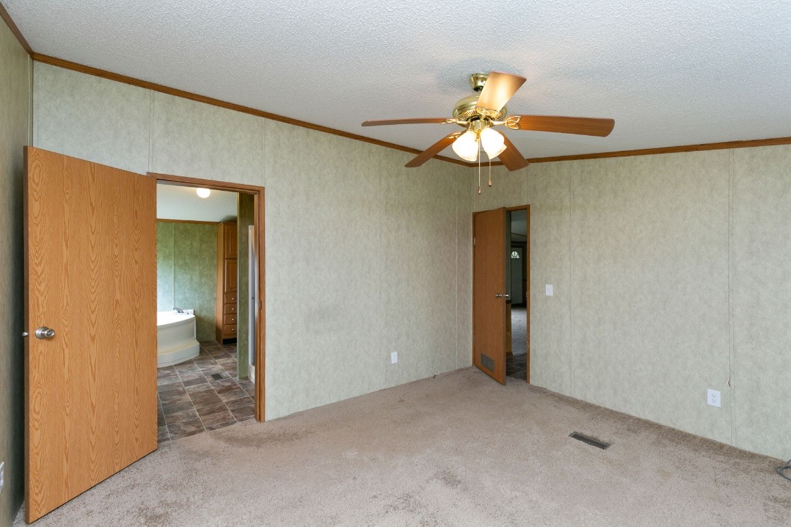 399 Calvert Ridge Road Westmoreland, TN 37186 - Photo 16 of 31 a view of an empty room and chandelier fan