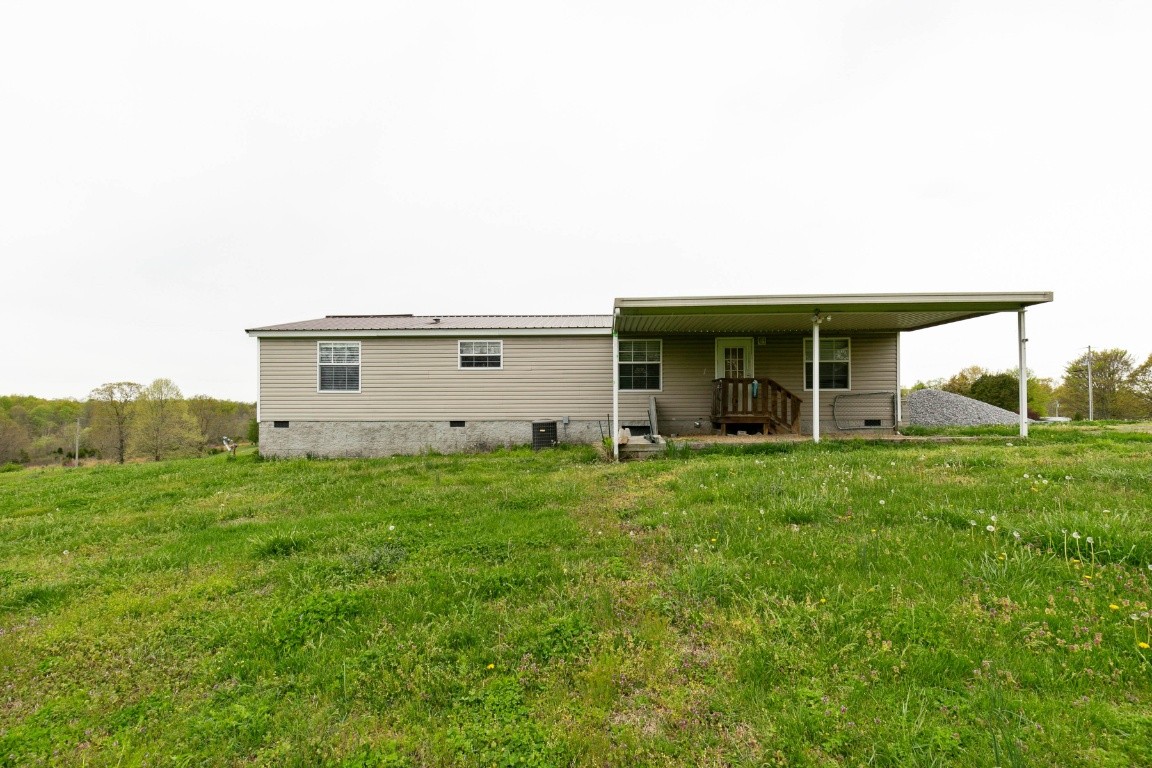 399 Calvert Ridge Road Westmoreland, TN 37186 - Photo 29 of 31 a view of a house with backyard